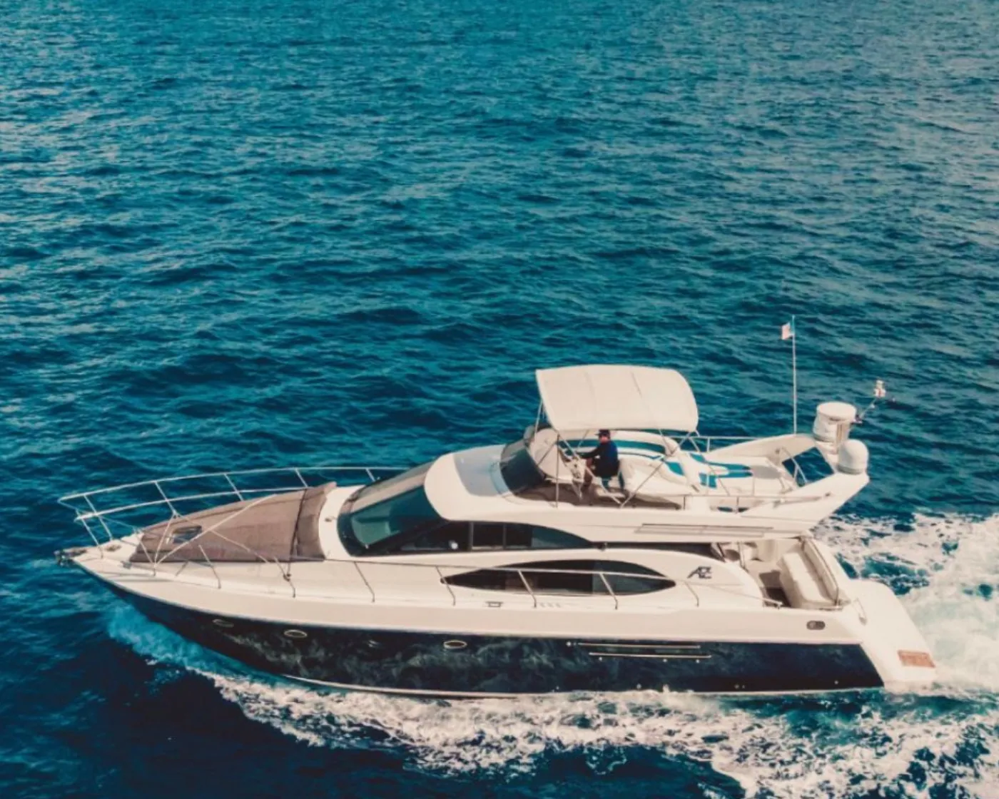 Private yacht on turquoise water in Tulum